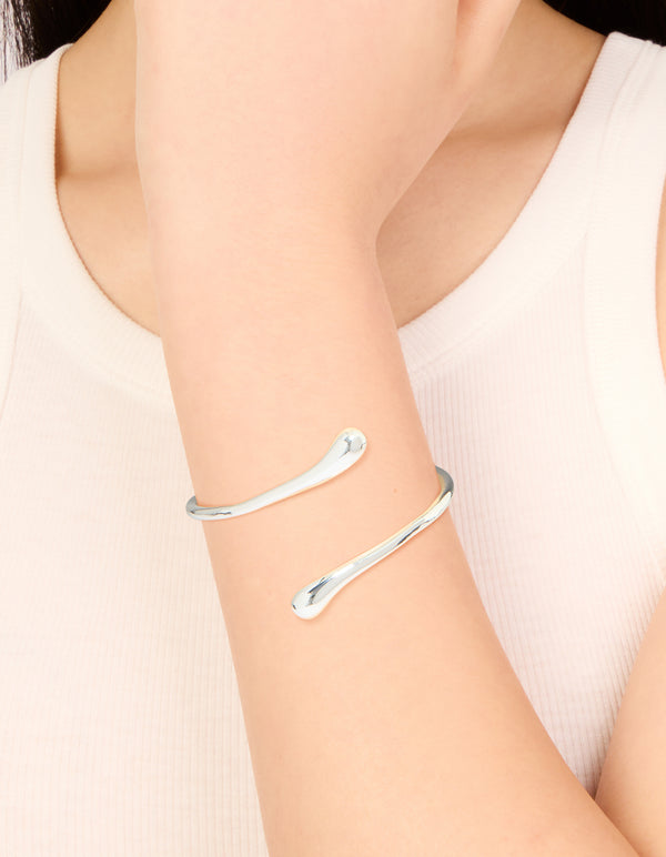 Discover this silver plated curved wrap hinged bangle in a sleek design on wrist view