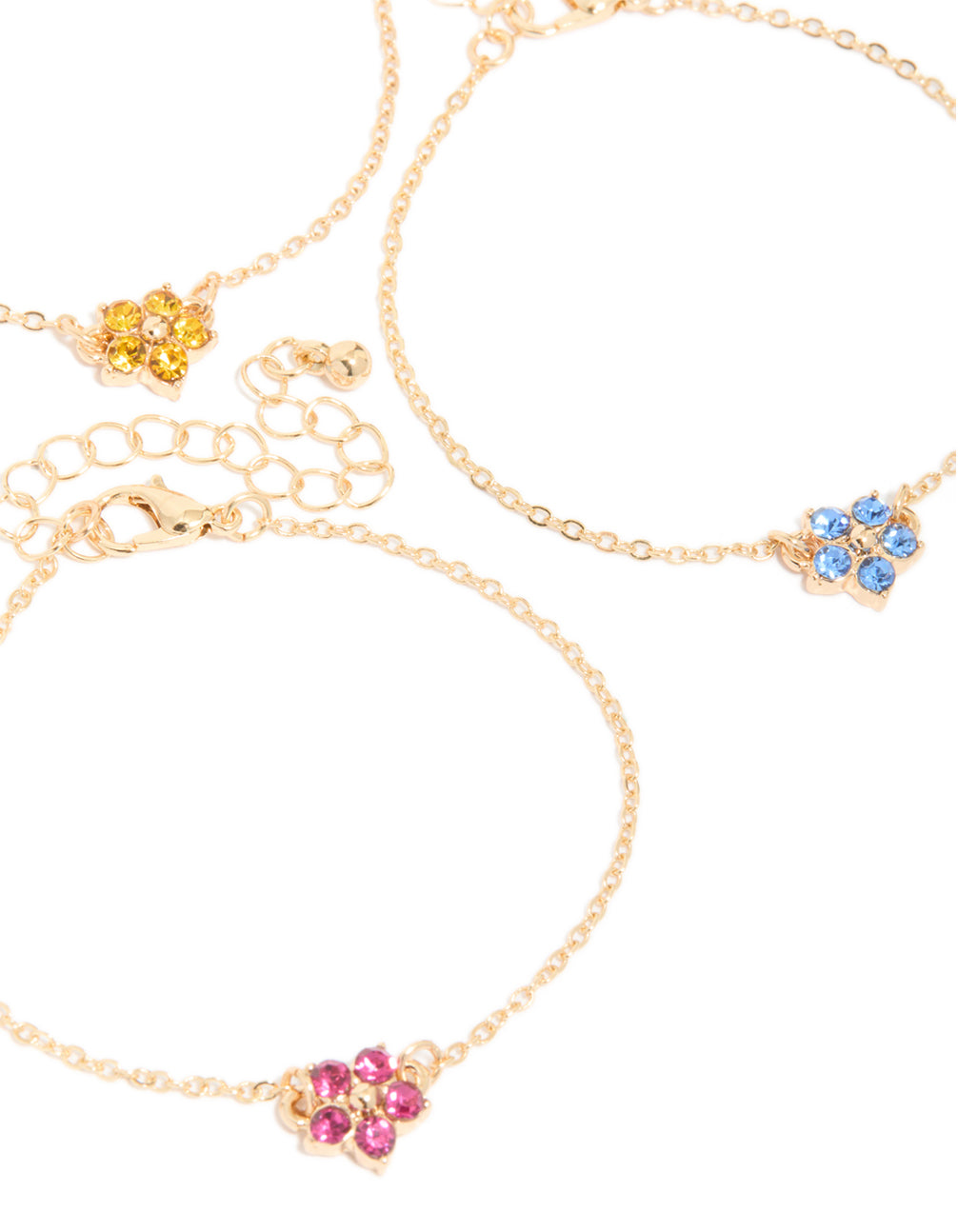 Crafted from gold with diamante flower accents, this 3-pack statement bracelet set showcases floral pattern in close up view