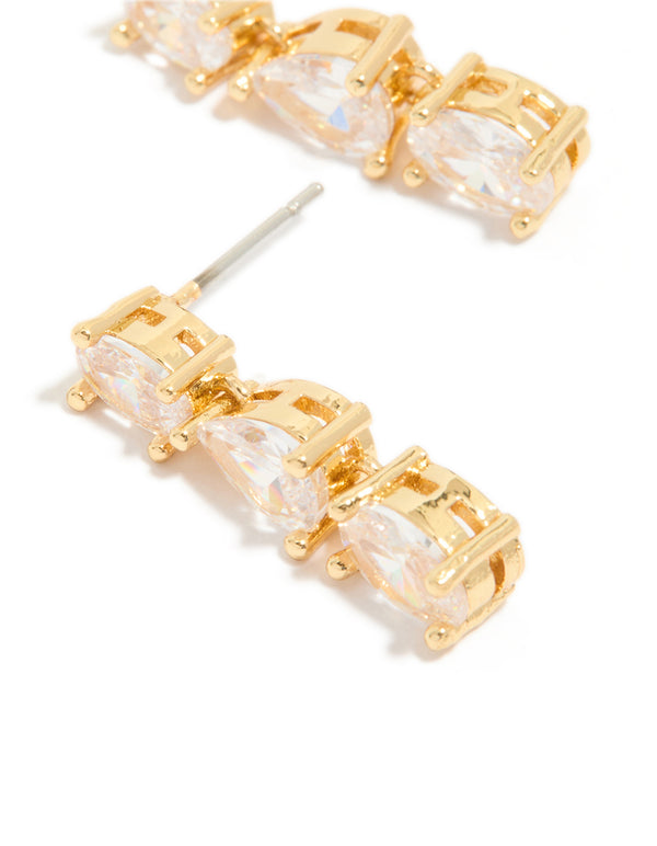 Displaying gold plated mixed cubic zirconia medium drop earrings with stone settings close up view
