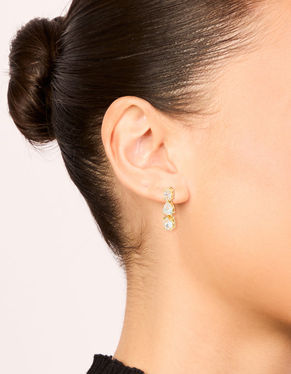 Showcasing gold plated mixed cubic zirconia medium drop earrings on ear view