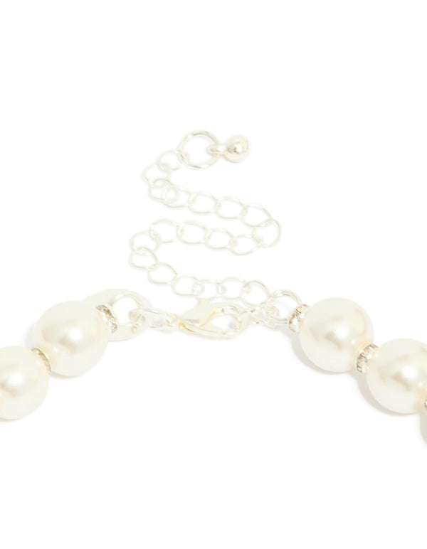 Crafted from silver plated material, this diamante and pearl necklace secures with an adjustable lobster clasp detail view