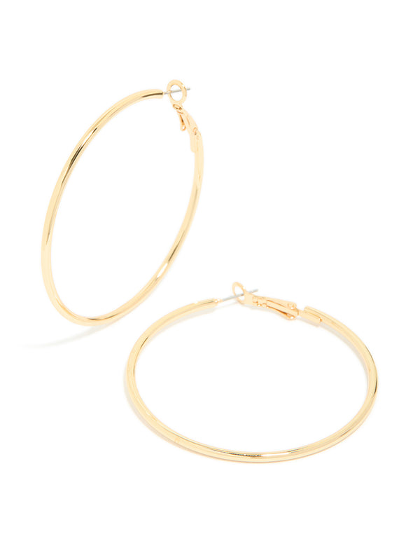 Featuring gold plated thin hoop earrings with closure detail front view