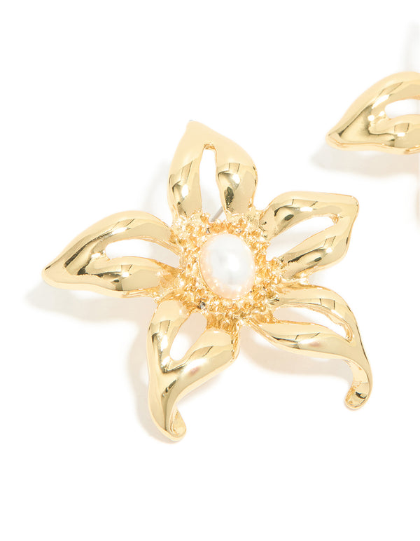 Elegant gold plated statement pearl flower earrings highlighting intricate metalwork close up view