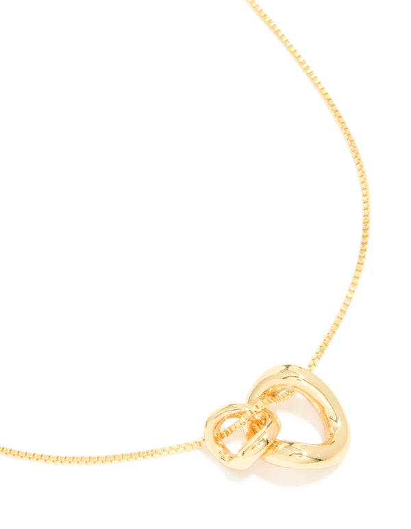 Crafted from gold plated material, this small double organic charm necklace features pendant close up view