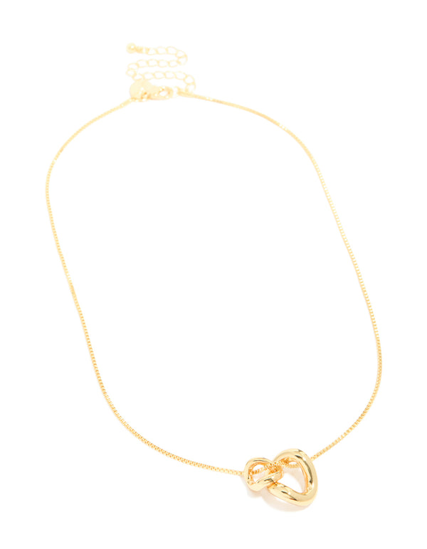 Designed with gold plated small double organic charm necklace featuring pendant front view