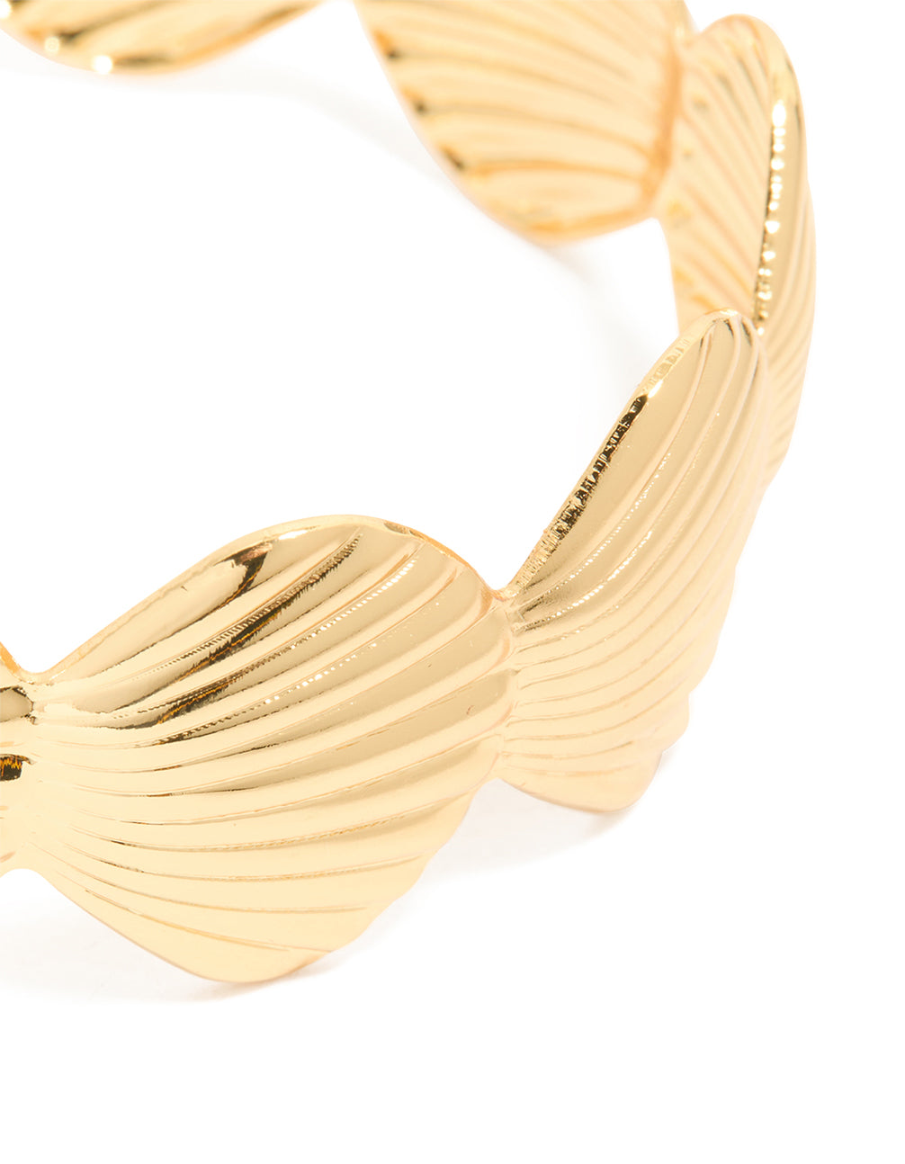 Crafted with gold plated shell statement wrist cuff featuring ocean-inspired chunky bracelet close up view