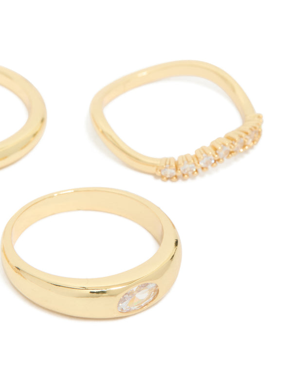Highlighting gold plated cubic zirconia and plain rings 4-pack with crystal details in stackable chunky styling side detail view