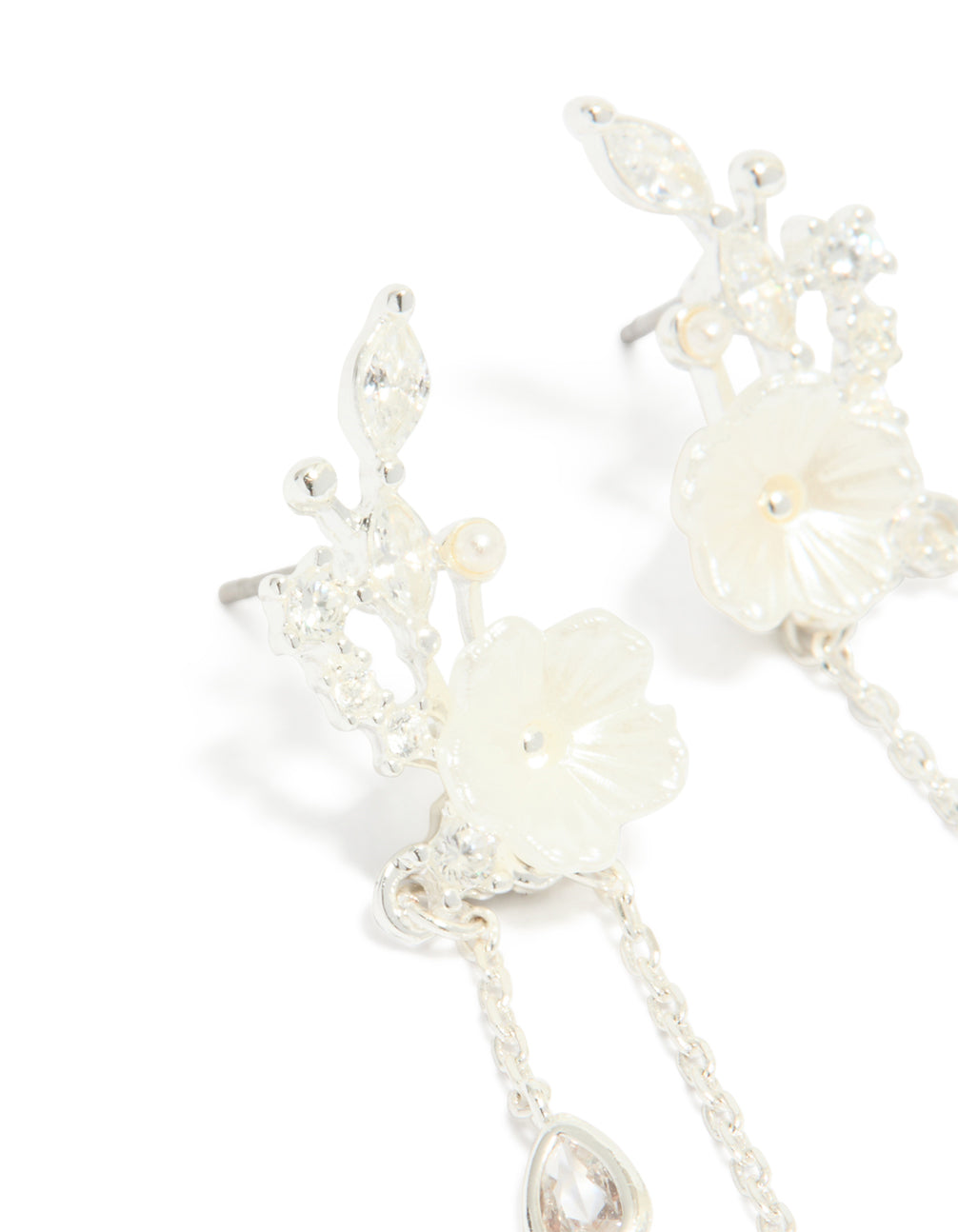 Detailed view of silver plated cubic zirconia flower and pearl chain drop earrings with floral pattern in ivory with a close up view