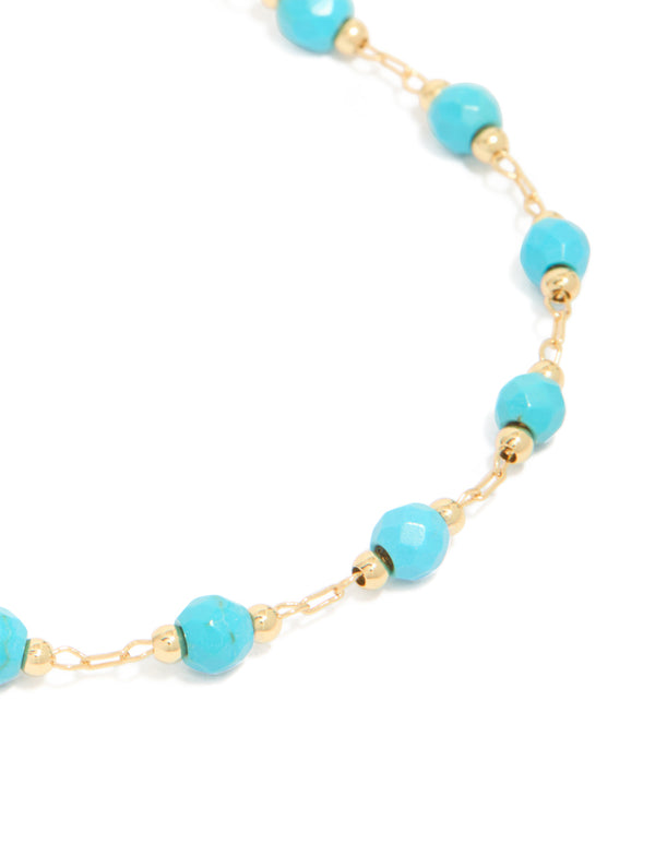 Detailed gold plated turquoise semi precious stone bracelet showcasing close up view