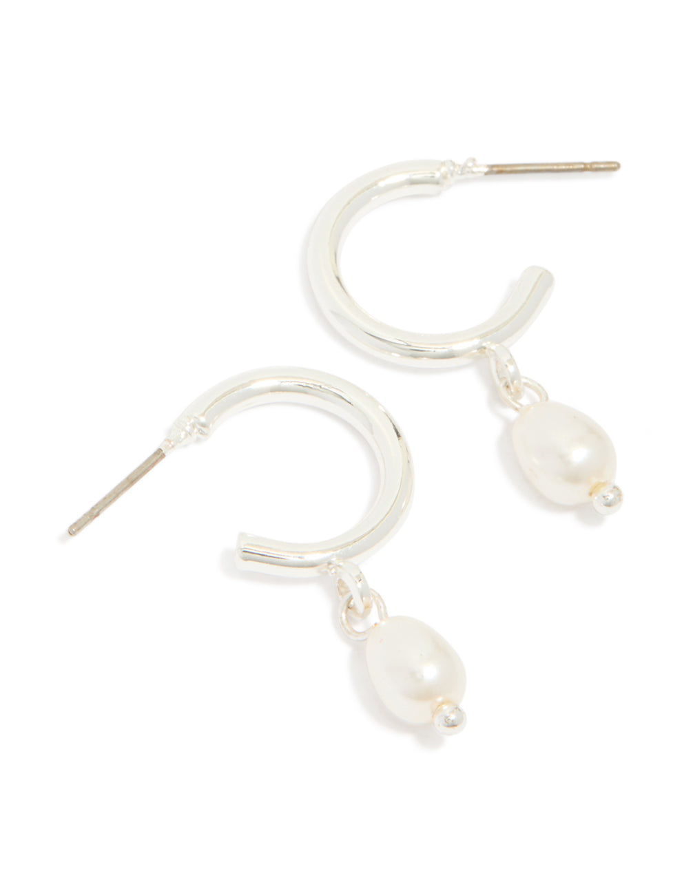 Featuring statement huggie earrings with pearl charm drop in silver front