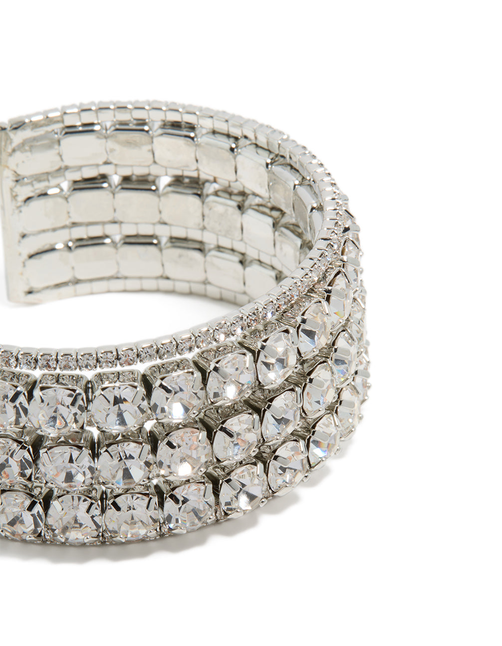 Featuring radiant diamantes, this large statement wrist cuff bangle in silver highlights intricate details in close up view