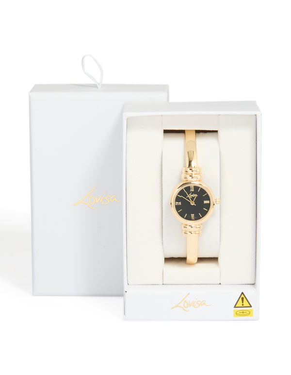 Discover this gold plated bangle watch with black dial featuring roman numerals in round shape for women designed with bangle and casual analog style case detail view
