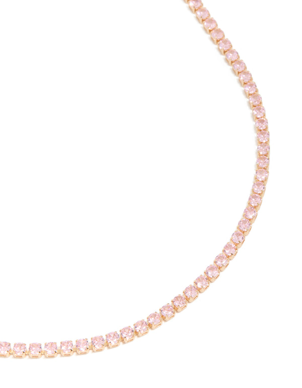 Beautifully crafted dainty gold cubic zirconia tennis necklace in light pink close up view