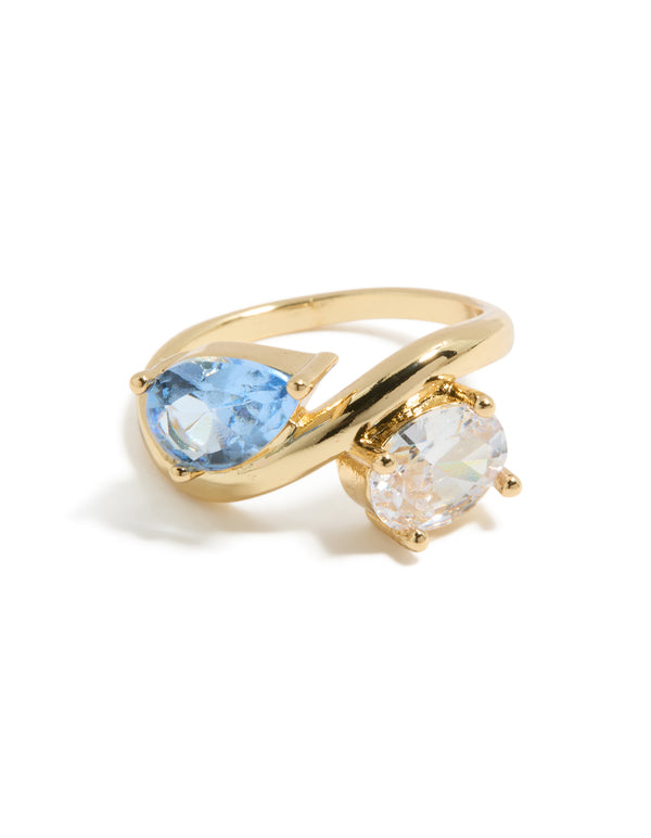 Gold plated ring featuring clear and blue cubic zirconia side detail view