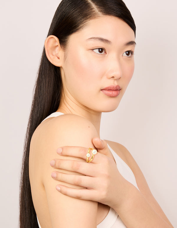 Featuring waterproof gold plated stainless steel pearls split band ring on finger view