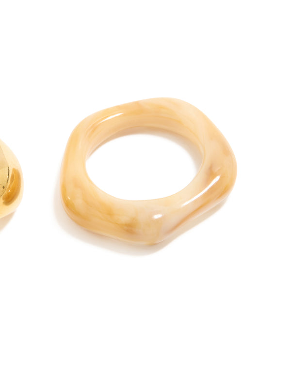 Crafted from waterproof gold plated stainless steel and acrylic, these stacking rings in a 3-pack offer close up view
