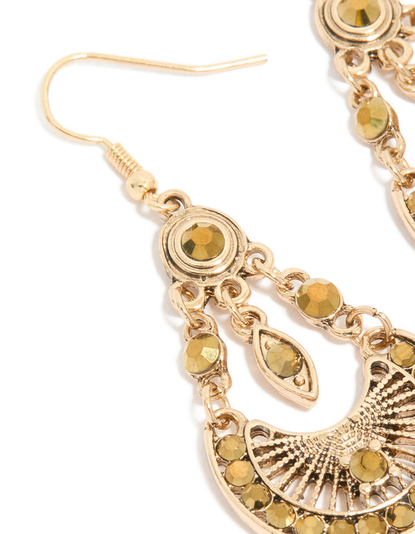 Detailed view of gold boho dangly drop charm earrings close up view