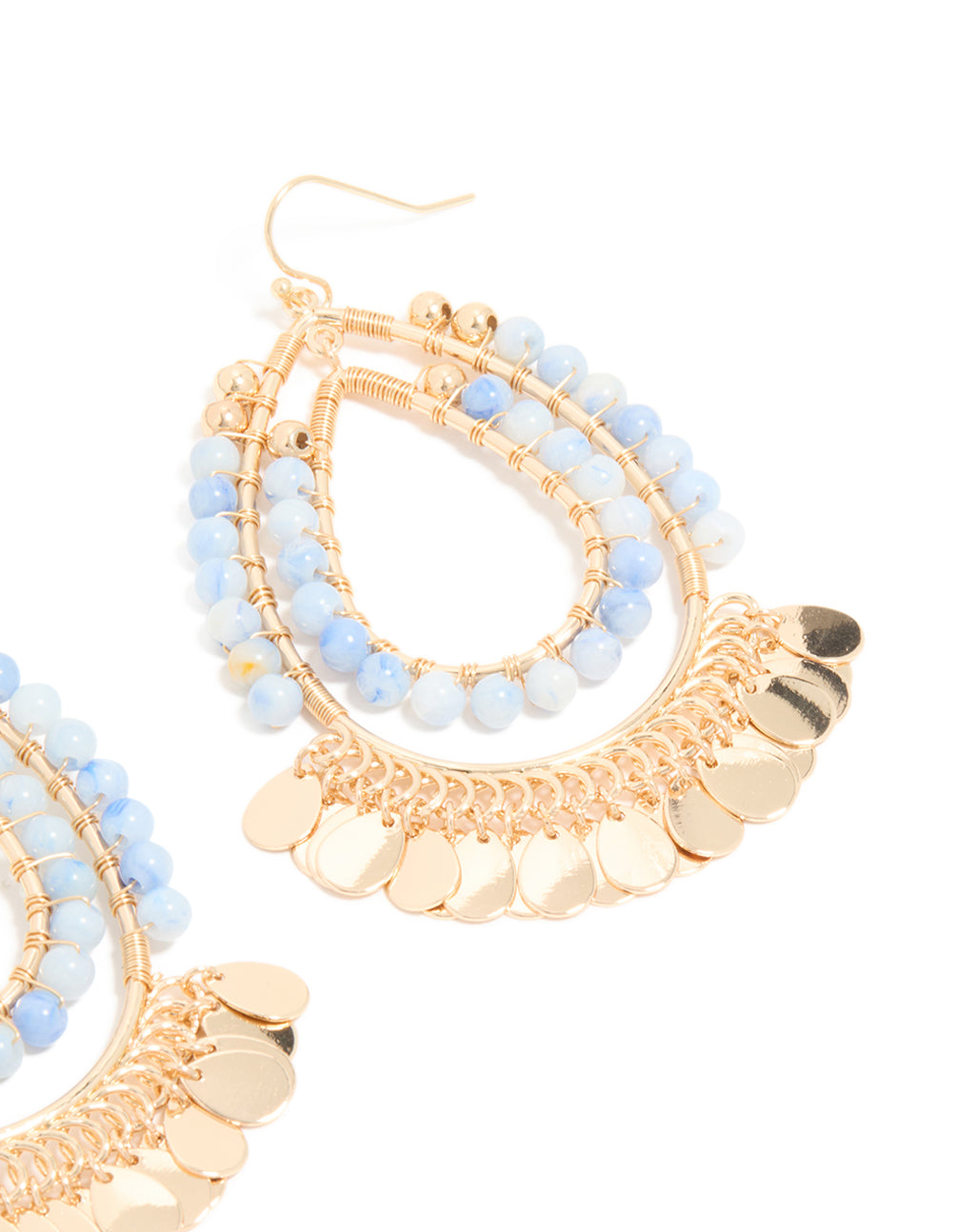 Highlighting statement teardrop earrings crafted with blue beads and gold disc layered elements post detail view
