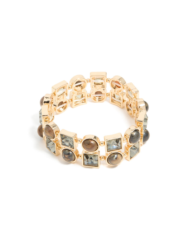 Showcasing a gold brown acrylic and diamante accents stretch bracelet in statement style front view
