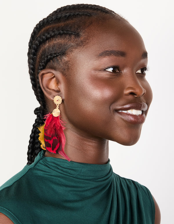 Crafted from gold with hot pink and yellow feather drop earrings featuring statement style on model view