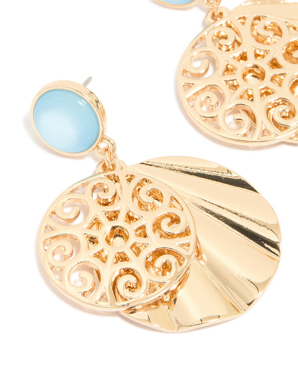 Featuring gold blue circle and swirl drop earrings showcasing light sky blue accents and statement style close up view