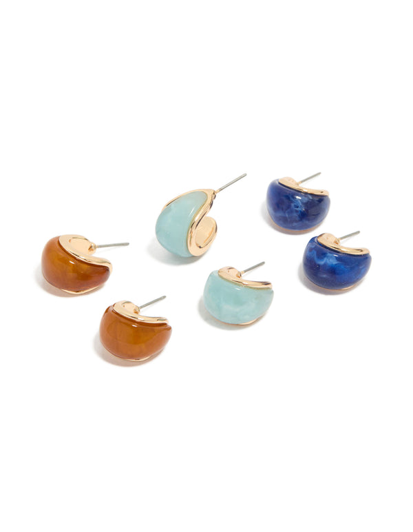Showcasing gold blue and brown enamel bubble hoop earrings in a 3-pack with on ear view