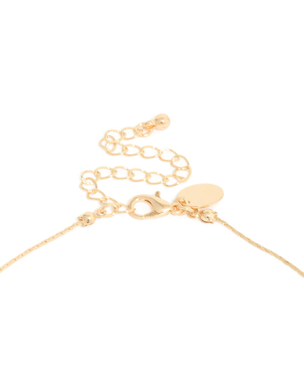 Crafted with a gold long blue beaded necklace featuring textured balls and statement style clasp detail view