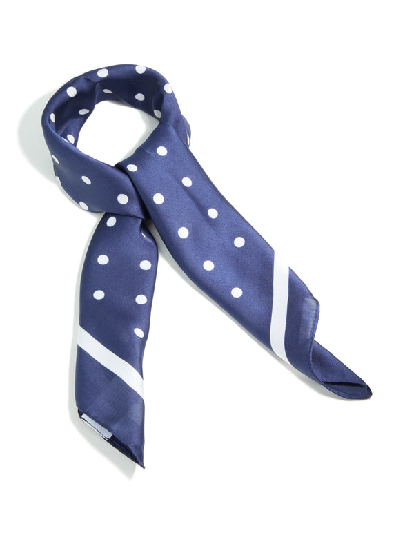 Showcasing a navy and white polka dot fabric square bordered scarf side view