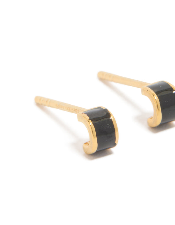 Elegant tiny gold plated sterling silver stud earrings featuring black enamel close up view
