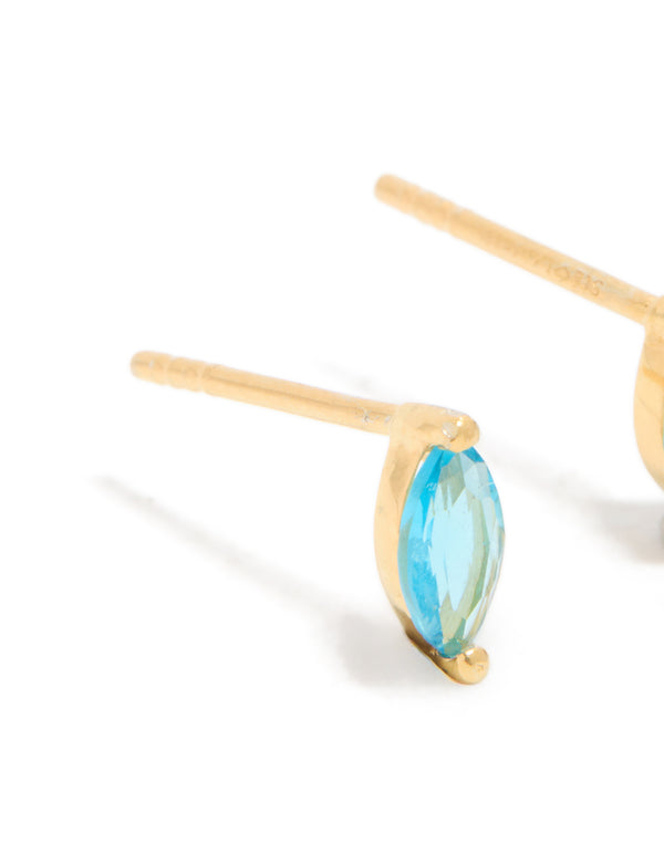 Detailed view of marquise cut aqua cubic zirconia set in gold plated sterling silver stud earrings close up view