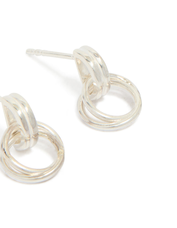 Crafted from sterling silver, these doorknocker stud earrings showcase interconnected rings and post closure detail view