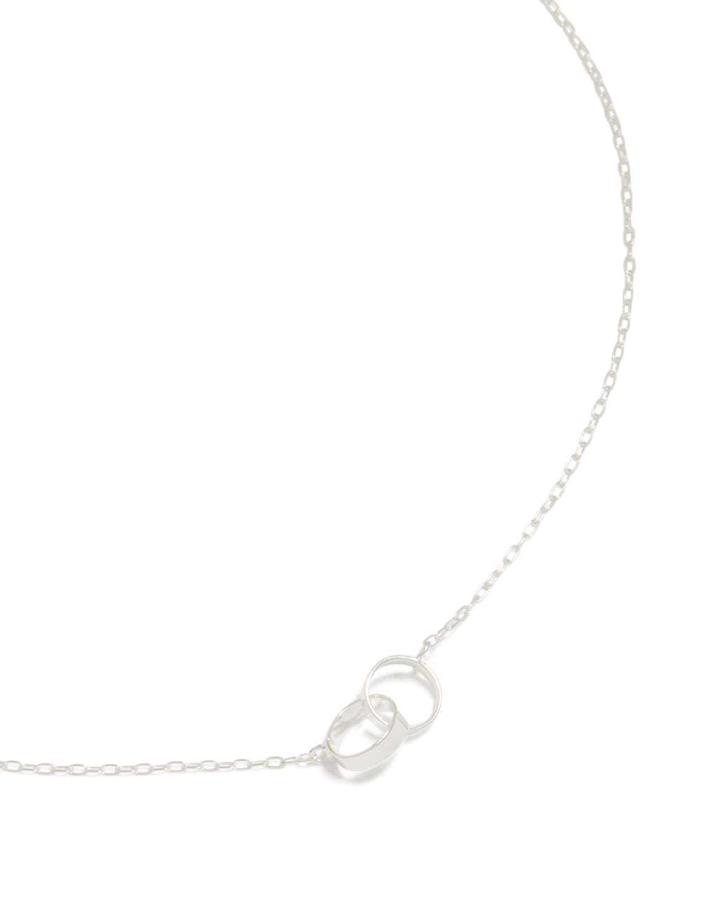 This stunning piece showcases interlocked hoops crafted from sterling silver featuring a pendant in a beautiful necklace design close up view