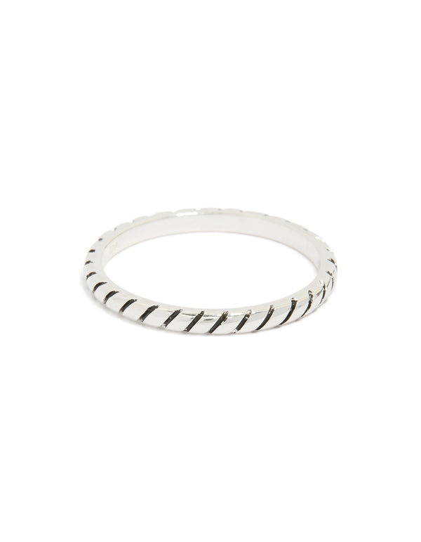Crafted from sterling silver with textured black enamel in a statement ring close up view