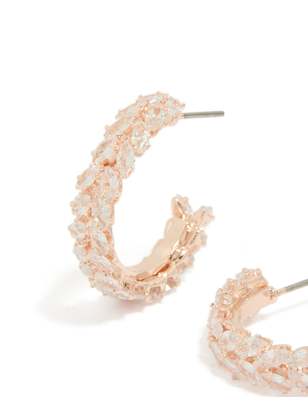 Detailed perspective of rose gold plated medium leaf hoop earrings featuring cubic zirconia close up view
