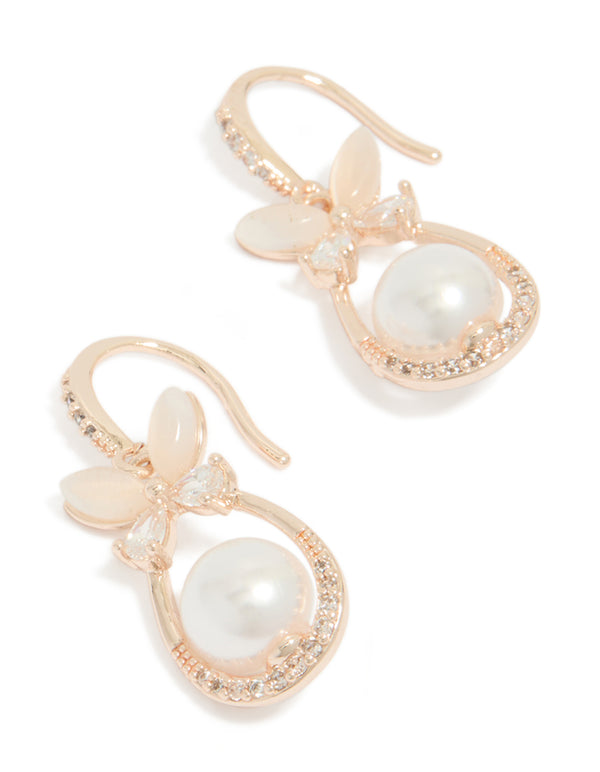 Showcasing dainty butterfly charm oval hook earrings with white pearls, floral pattern, and cubic zirconia in rose gold plated finish front view