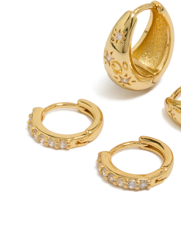 Crafted from brass, these dainty style gold plated huggie earrings in a 2-pack feature celestial star and teardrop designs with fine cubic zirconia crystal detailing close up view