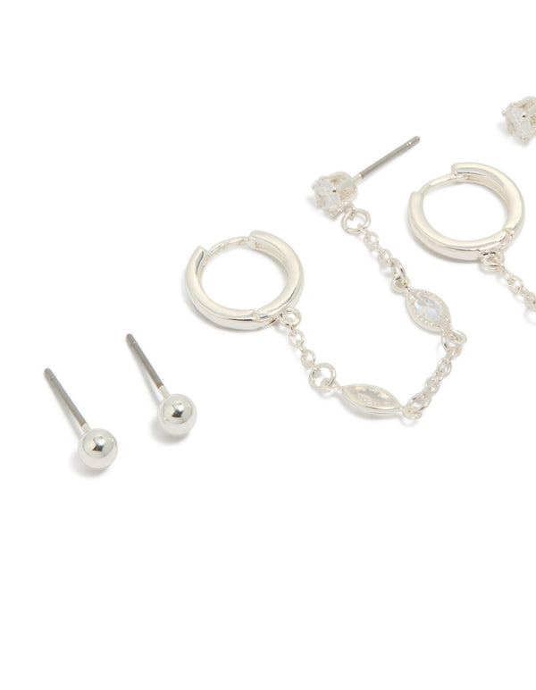 Showcasing statement silver plated brass chain and stud earrings 4-pack with charm details featuring crystal and cubic zirconia, huggie closure close up view