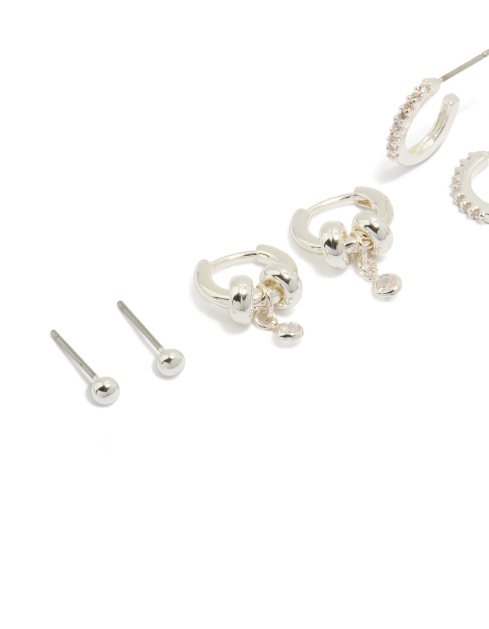 Showcasing dainty silver plated brass double rondell huggies and stud earrings in a 4-pack with crystal accents close up view