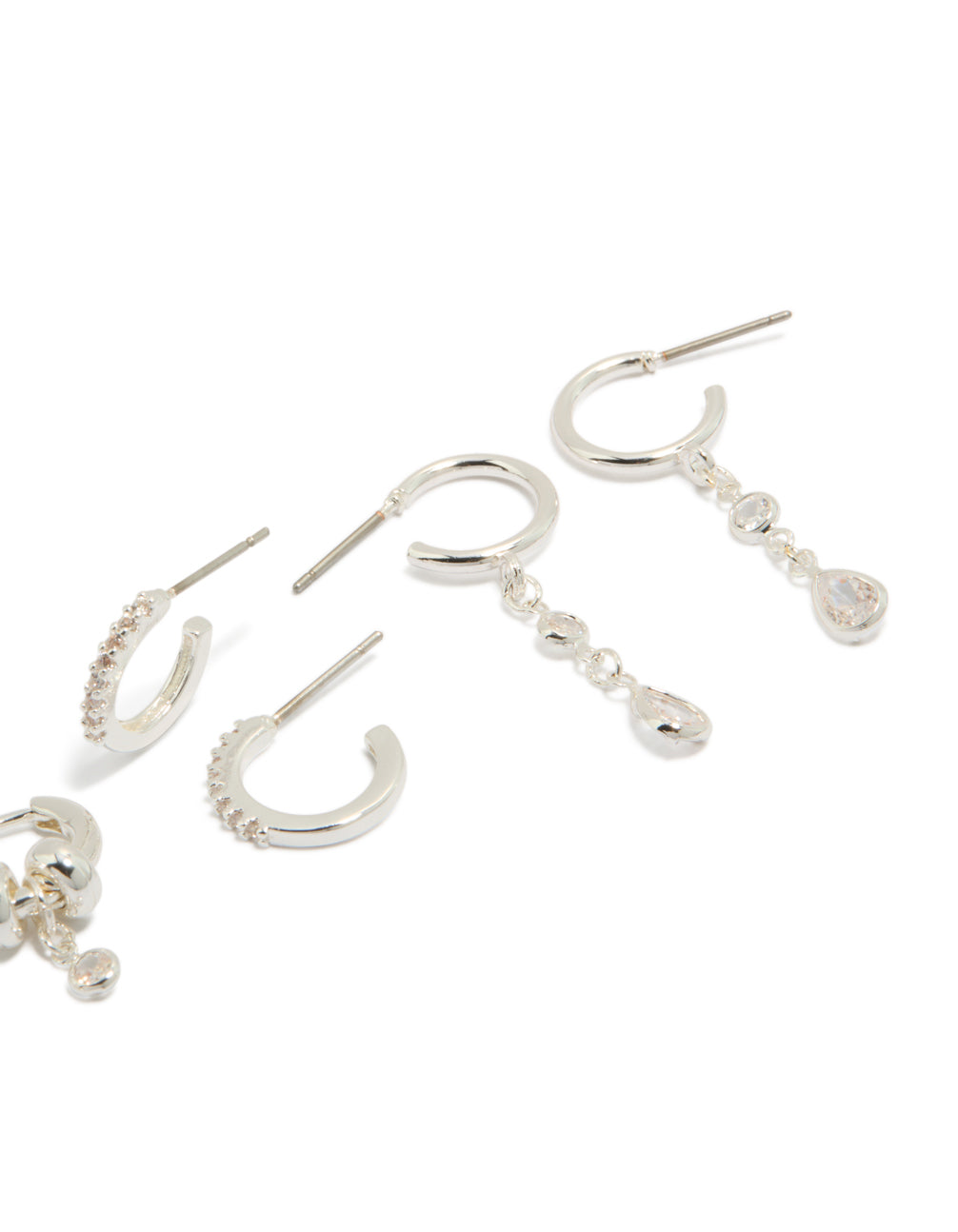 Crafted from silver plated brass, these dainty double rondell huggies and stud earrings in a 4-pack with crystal accents post detail view