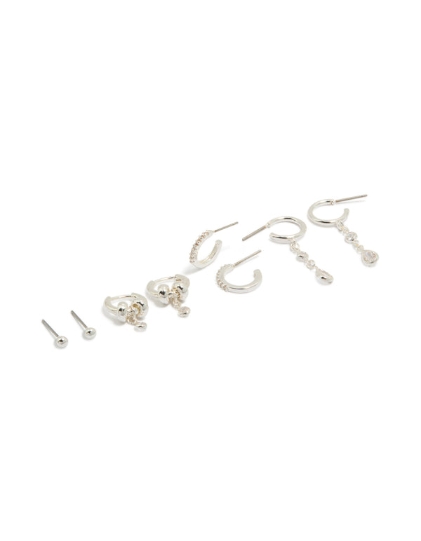 These dainty silver plated brass double rondell huggies and stud earrings feature crystal accents in a convenient 4-pack front view