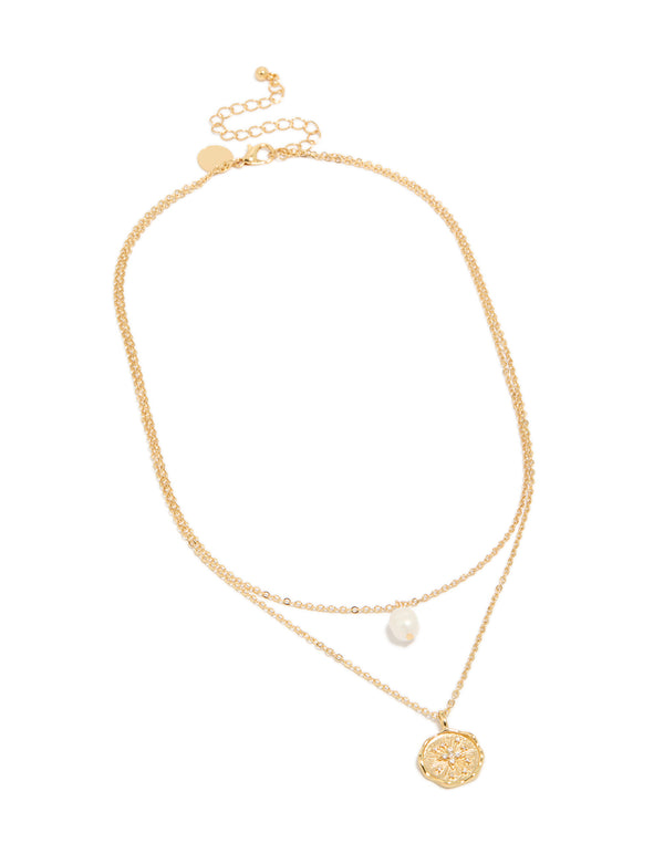Featuring a gold plated brass necklace with layered design, celestial, coin pendant, pearl and cubic zirconia details front view