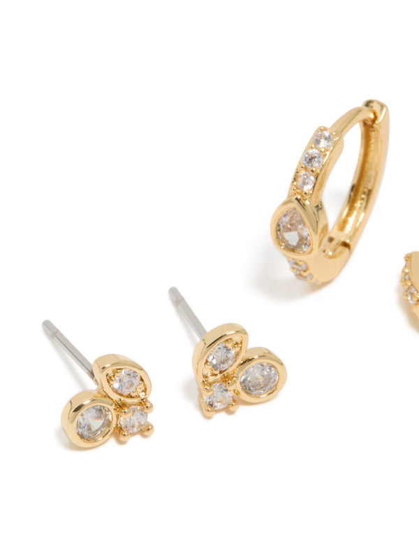 Showcasing gold plated cubic zirconia trio stud and huggie earrings in a 2-pack close up view
