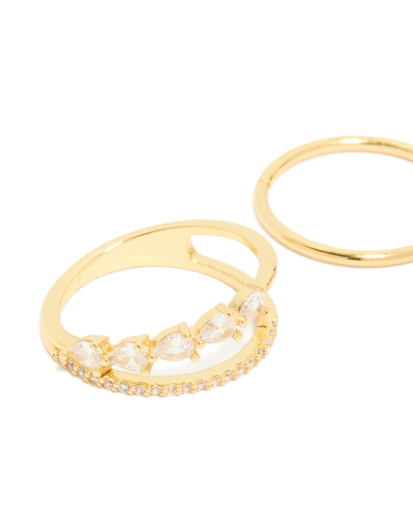 Showcasing gold plated cubic zirconia teardrop and band rings with crystal details in a dainty 3-pack close up view
