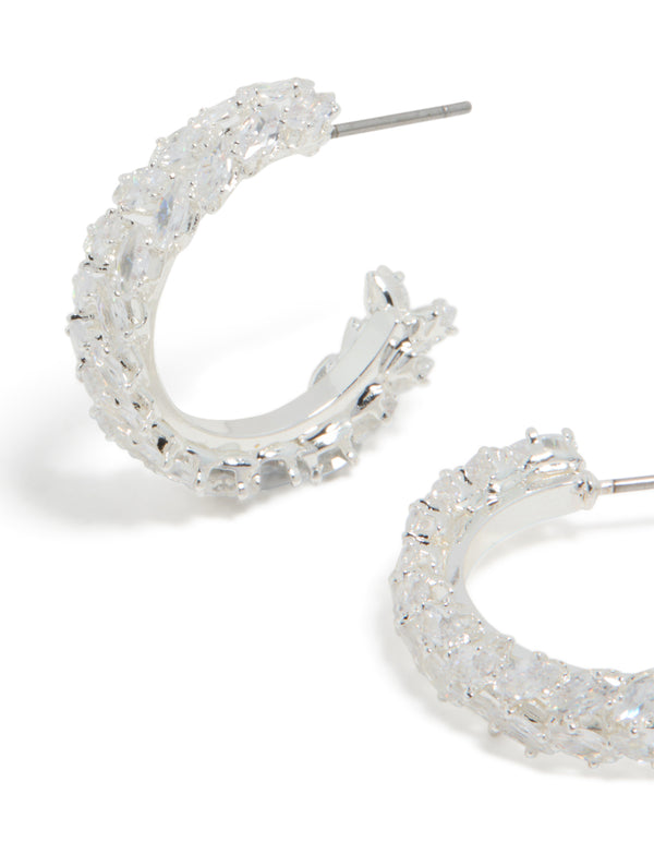 Detailed silver plated medium leaf hoop earrings with cubic zirconia close up view