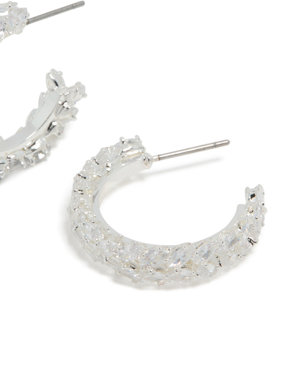 Crafted from silver plated material, these medium leaf hoop earrings feature cubic zirconia post detail view