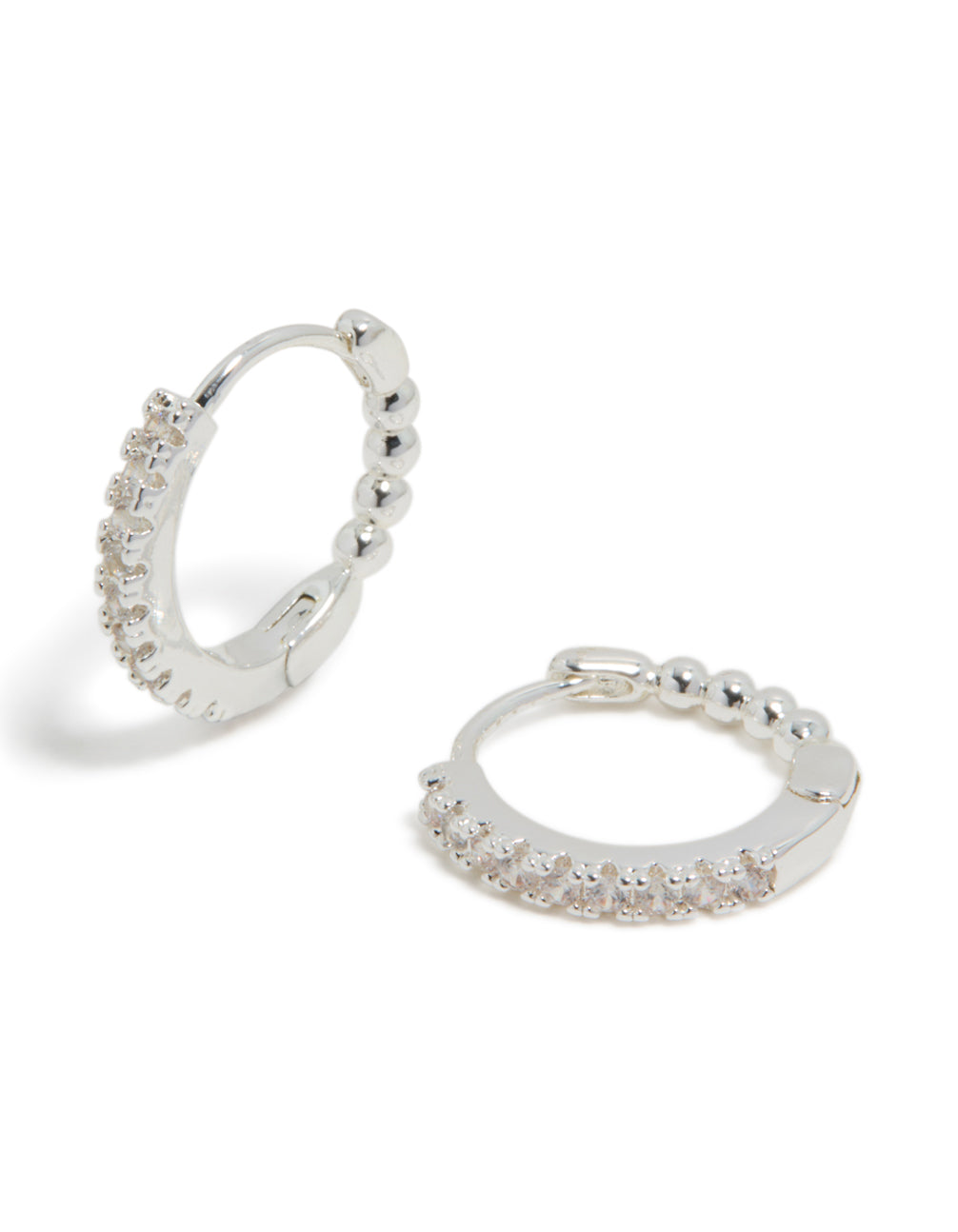 Showcasing skinny huggie earrings crafted from silver plated material featuring cubic zirconia front view