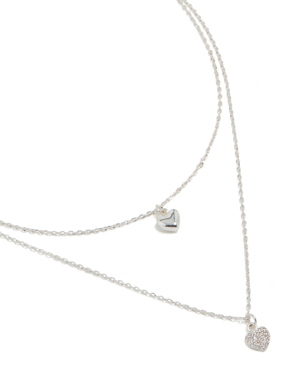 Showcasing a silver plated cubic zirconia double layered heart pendant necklace front view