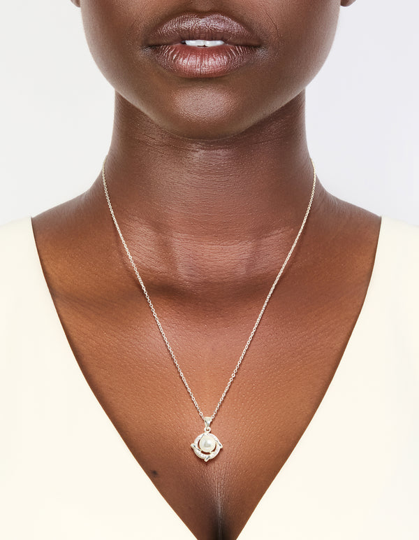 Elegant silver plated cubic zirconia pearl centre pendant necklace on neck view