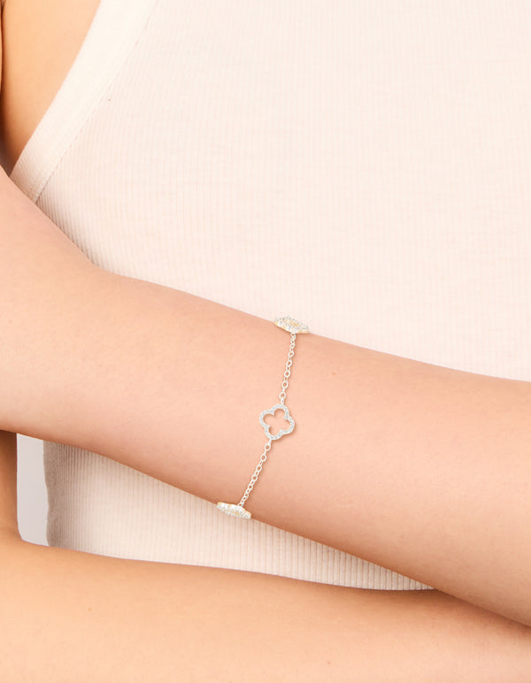 Crafted from silver plated material, this cubic zirconia outline flower bracelet is shown on wrist view