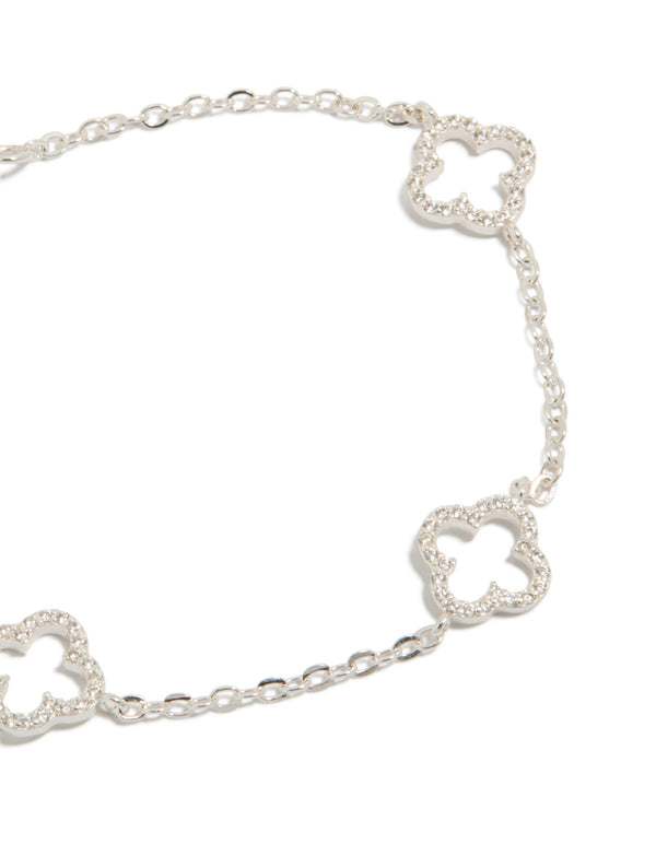 Designed with floral outline and cubic zirconia detailing, this silver plated bracelet displays refined elegance close up view